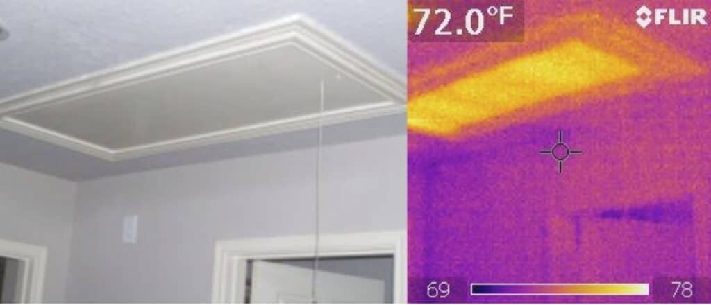 Infrared thermography showing attic access without insulation.